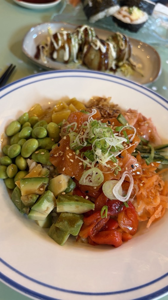 Salmon poke bowl with edamame, avocado and pickled vegetables