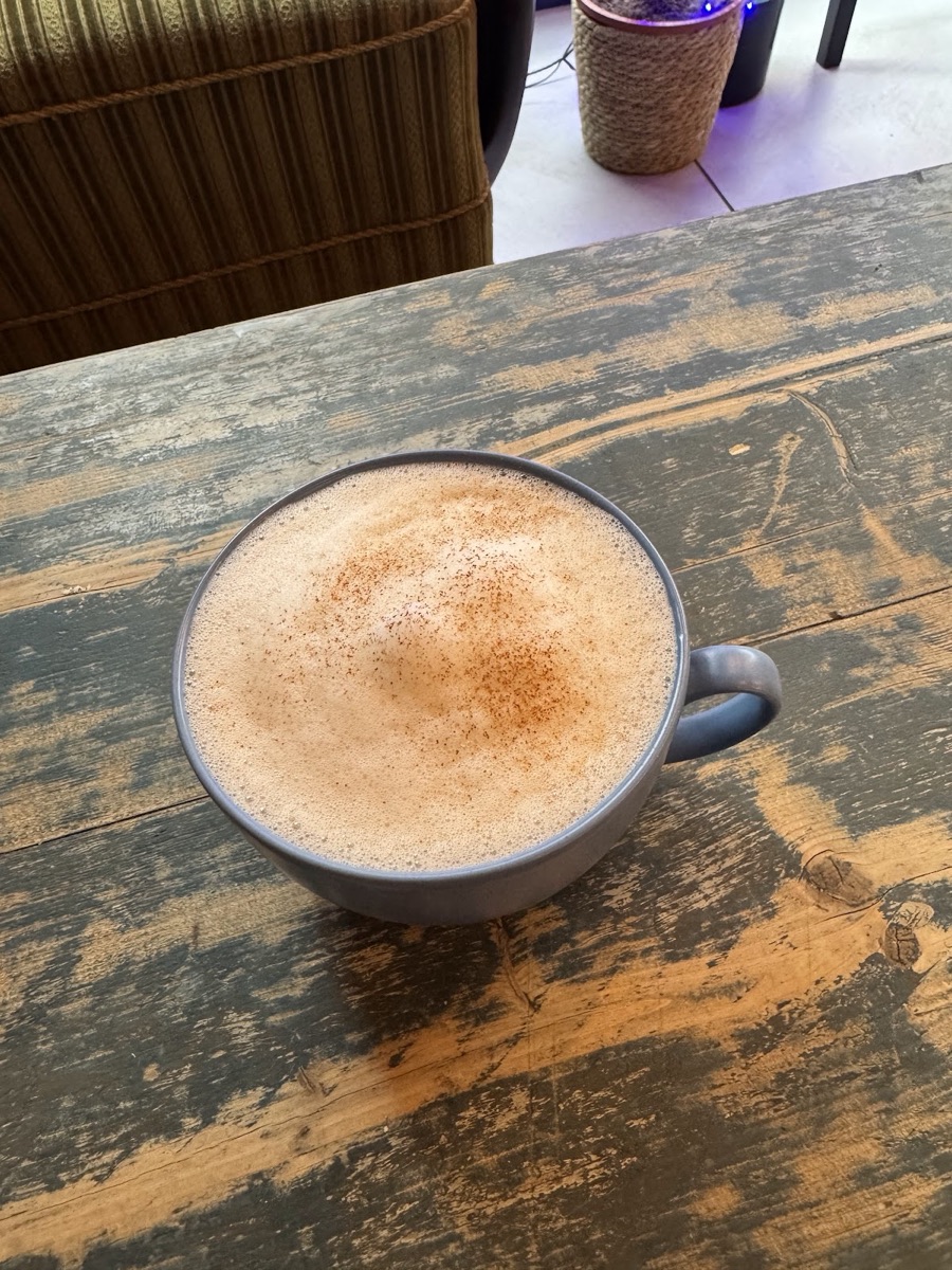 A spiced latte on the window table